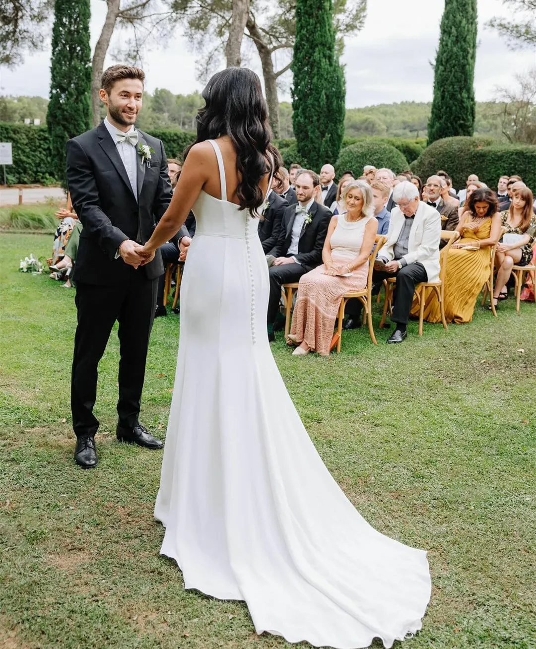 Bridal Dresses with Long Trains: Elegant Ivory Crepe Mermaid Wedding Gown with Square Neck and Covered Buttons Bridal Dresses with Long Trains: Elegant Ivory Crepe Mermaid Wedding Gown with Square Neck and Covered Buttons