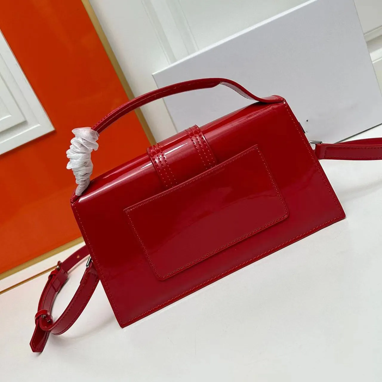 Designer red cross body bag sales