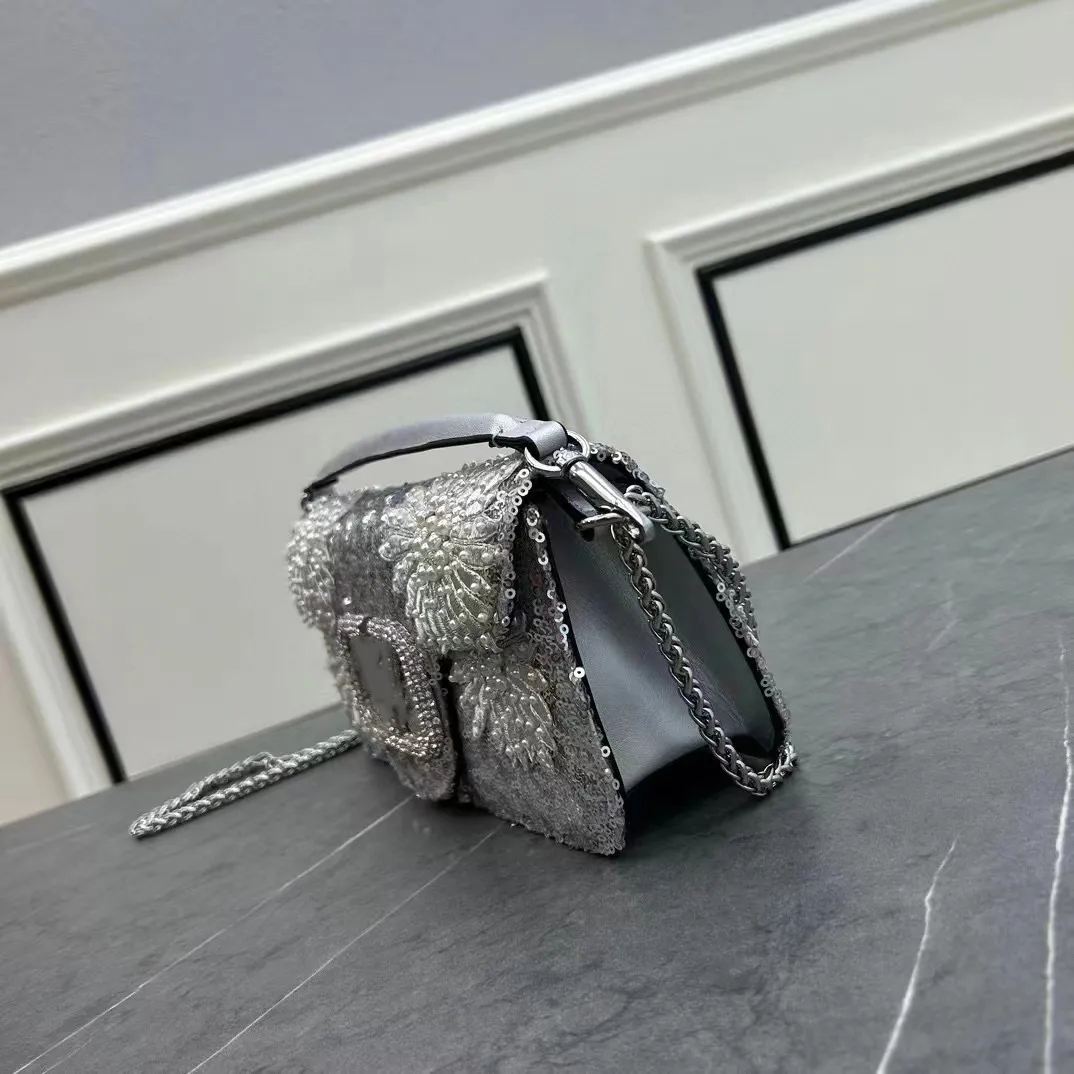Designer silver clutch bag clearance