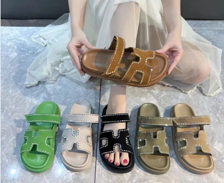 2024Designer diamond studded women s casual flat sandals wearing fashionable beach summer slippers on the outside
