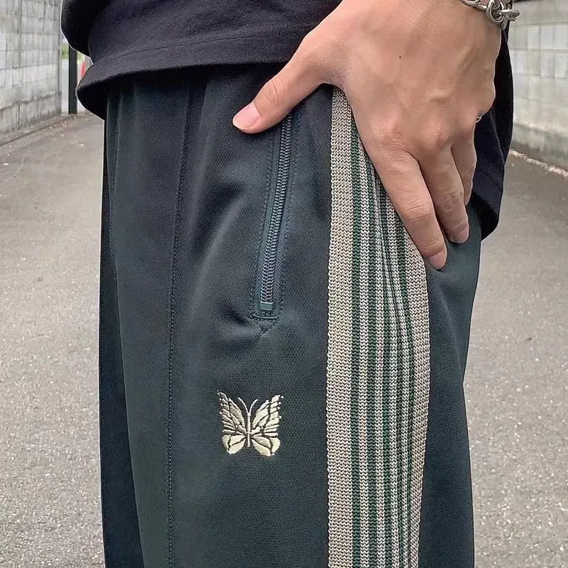 Y2K BOOT-CUT Poly Smooth Needles ladies track pants with Y2K BOOT-CUT Poly Smooth Needles ladies track pants with