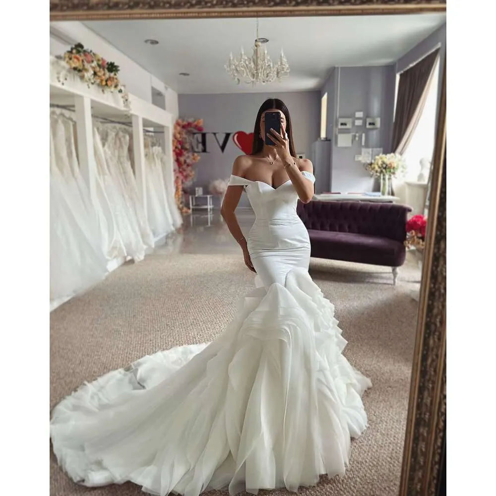 ruched tulle mermaid wedding dress Amazon.com: TSxuelian Women's Sexy Mermaid Wedding Dress with High Slit Tiered Ruffles Bridal Gowns Tulle Ivory : Clothing, Shoes & Jewelry