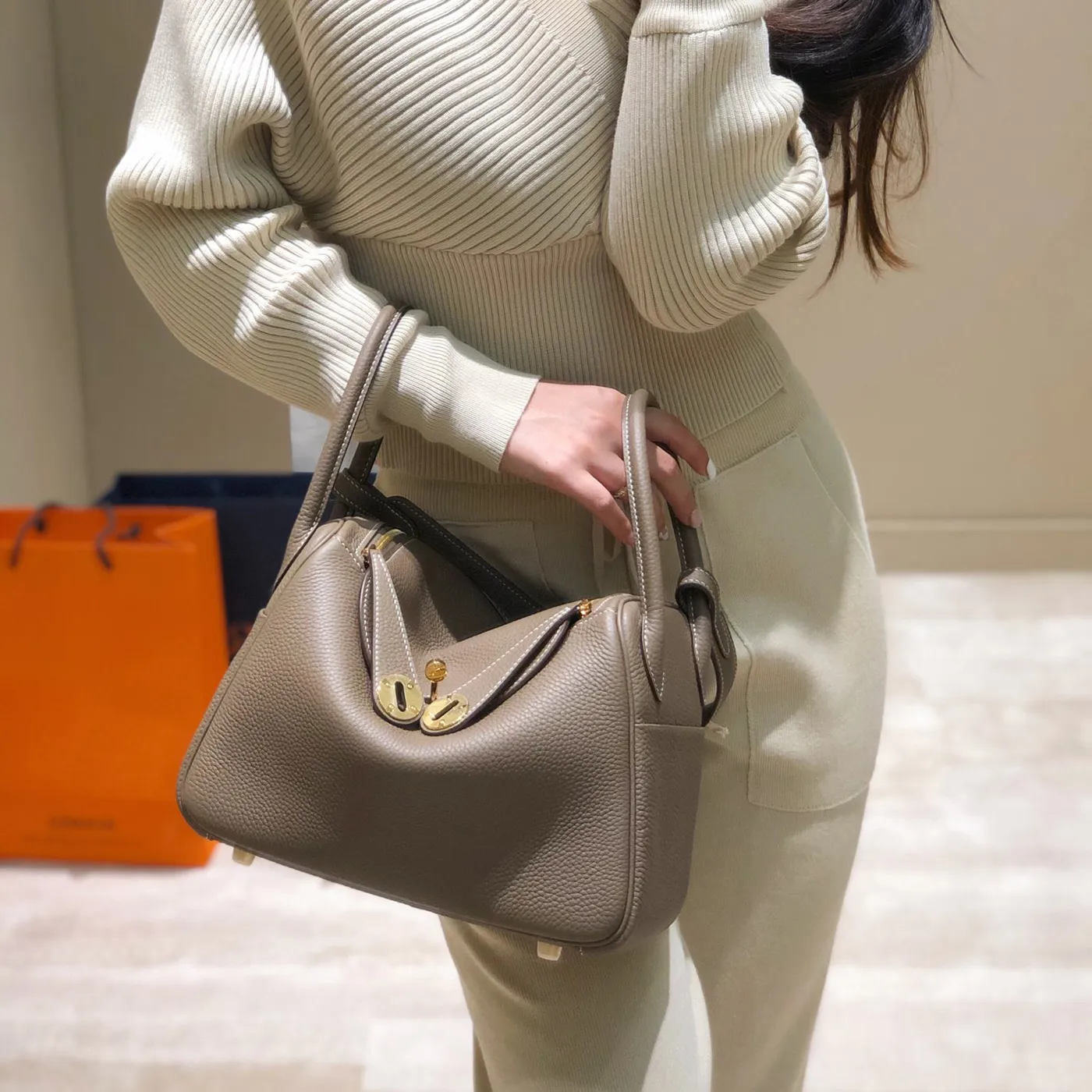 Designer bag with tc logo top