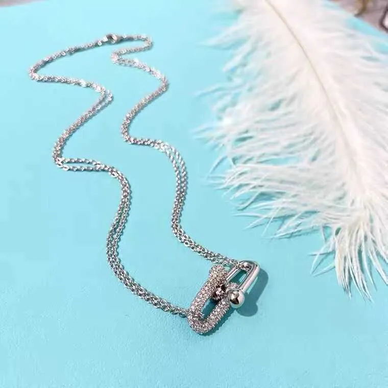 Tiffany & Co. Mini Horseshoe Pendant Necklace with Diamonds – Oliver  Jewellery