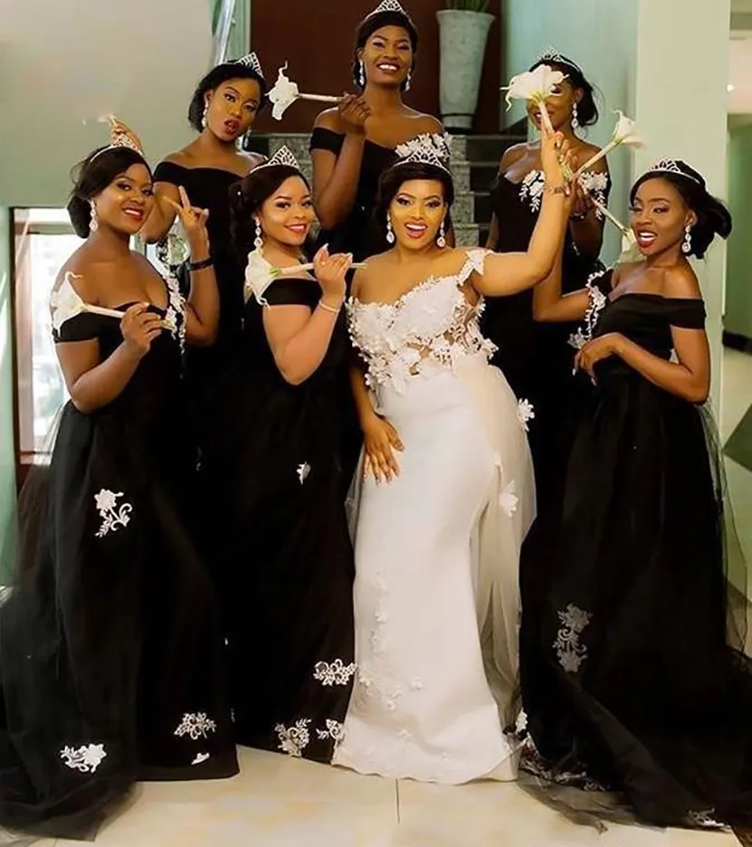 Stunning 2023 African Black Mermaid unique Black bridesmaid dresses with White Lace Appliques, Overskirt, and Off-Shoulder Design - Perfect for