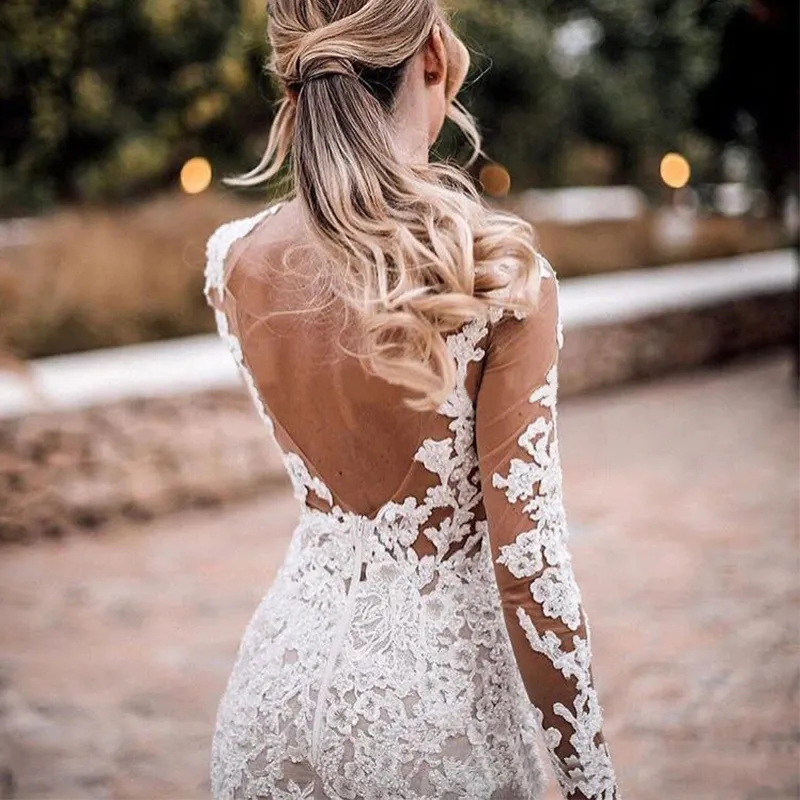 White Lace Applique Mermaid Boho Lace Wedding Dress with Illusion Sweetheart Neckline, Long Sleeves, and Open Back - Perfect for Formal Occasions